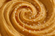 close-up image of swirl of caramel ice cream with sea salt