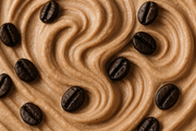 close-up image of swirl of light chocolate ice cream with whole coffee beans mixed into it